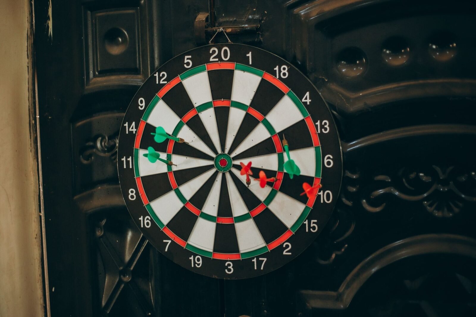 Professional darts player throwing a dart at a target board