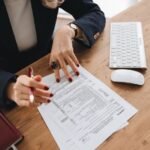 Accountant reviewing corporate tax documents and financial records