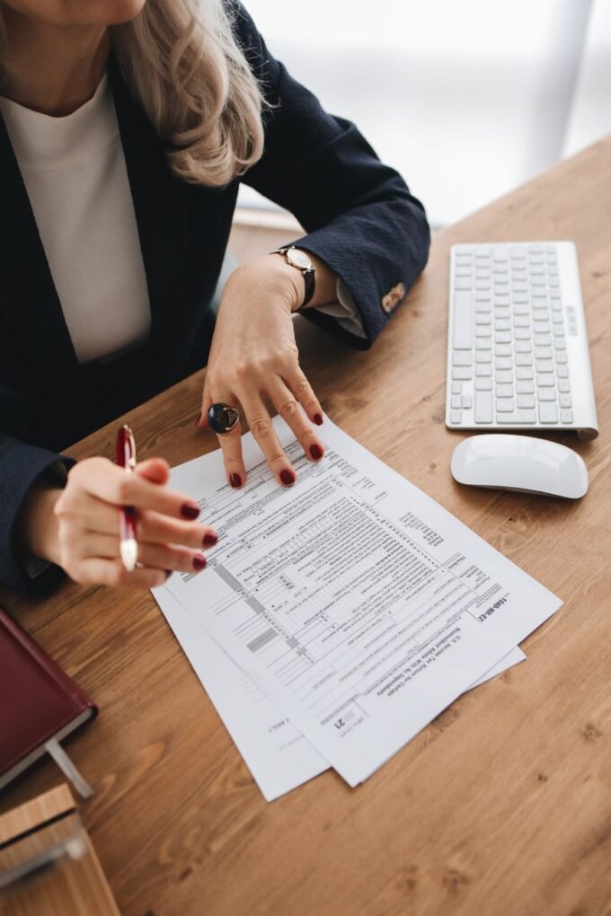 Accountant reviewing corporate tax documents and financial records